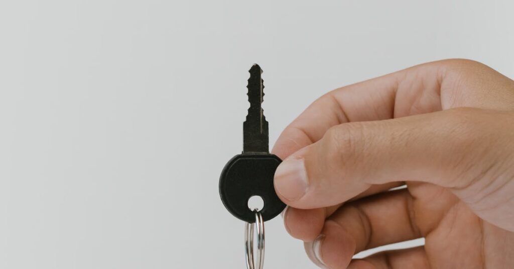Close-up of a hand holding a key and USB with copyspace.